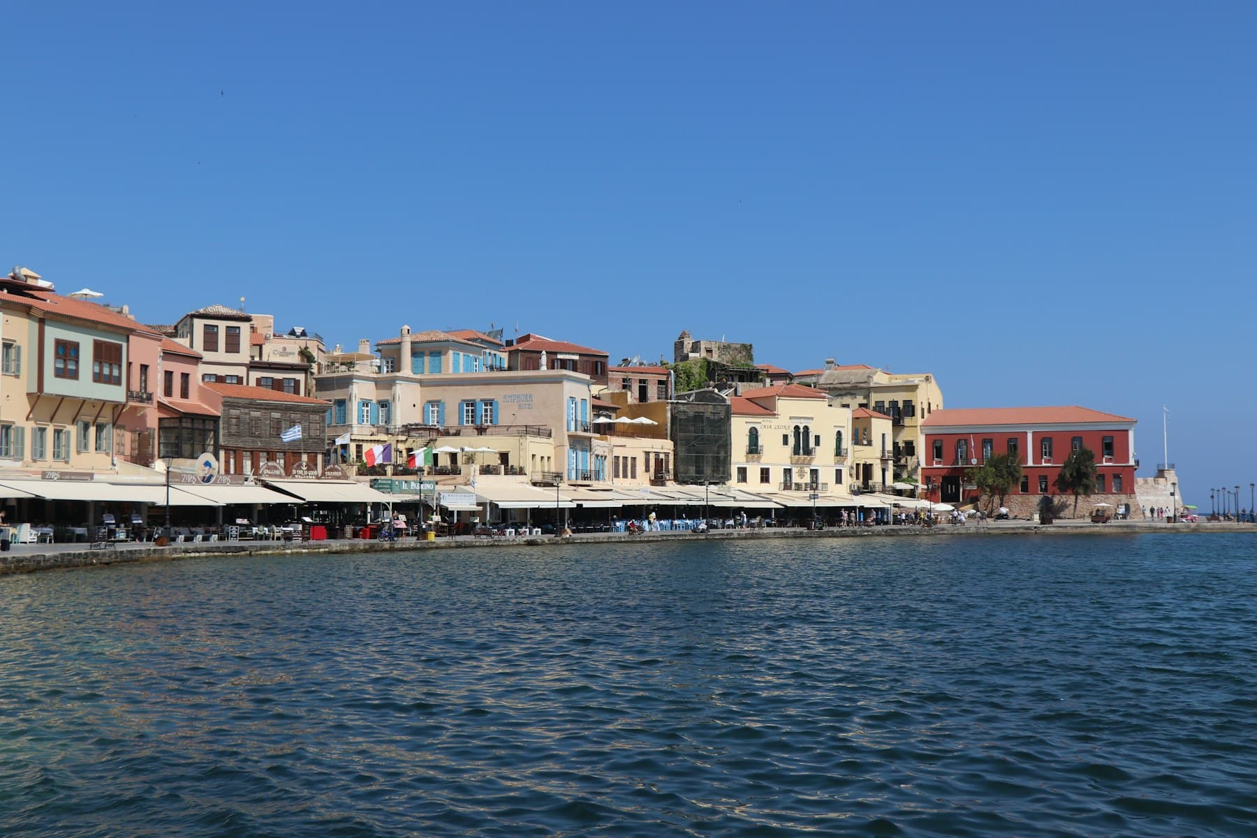 The Venetian harbour at Chania, Crete, lined with pastel houses