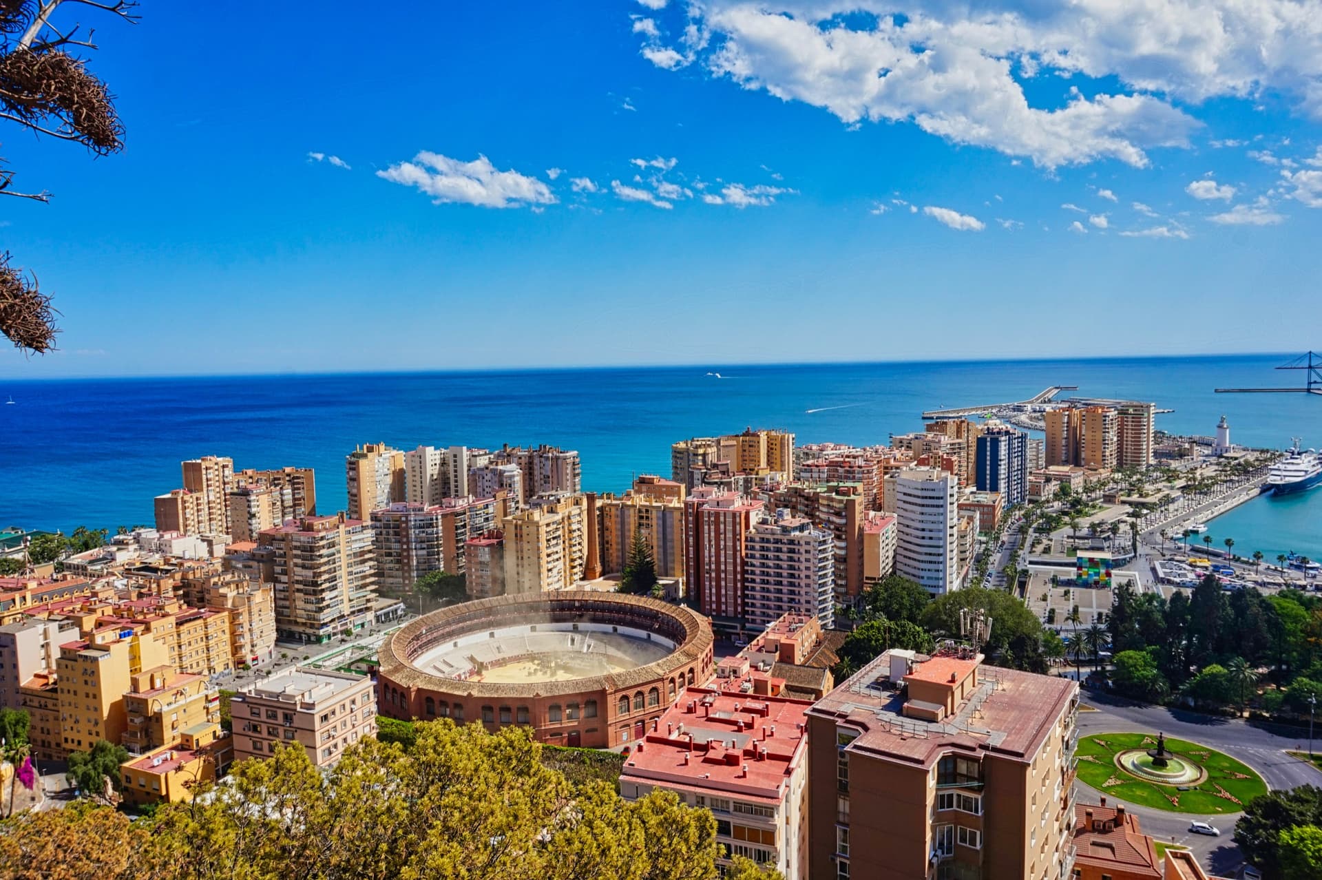 Málaga from above, the bullring and the port meeting the Mediterranean